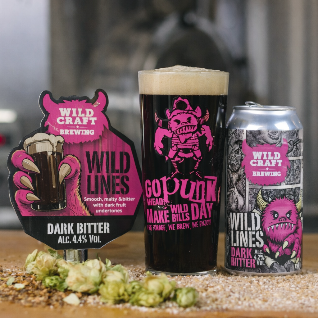 Cans of Wild Craft Brewing beer on a wooden surface with a blurred background
