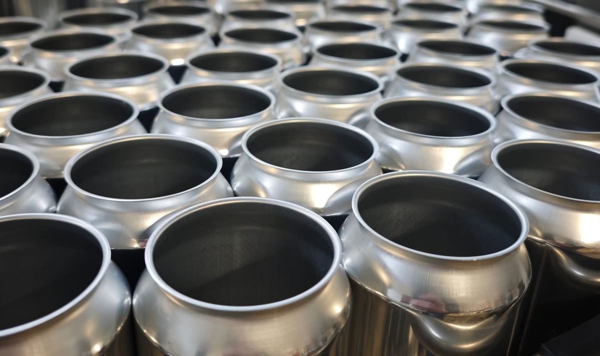 Rows of empty cans ready for packaging at the brewery