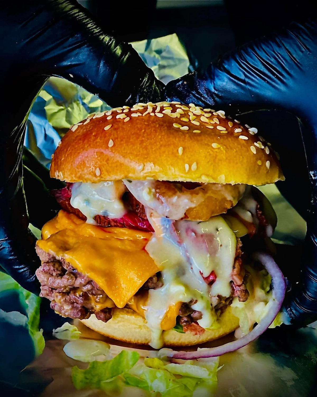 Kerbside Kitchen burger with cheese, onions and sauce